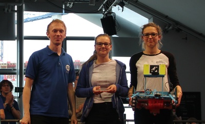The team from The Ladies' College holding their robot and being presented their second prize, the Rookie award